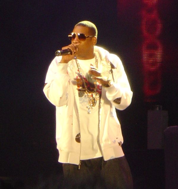 Hip hop artist Jay-Z performs in concert, holding microphone